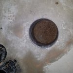 Starting to make the cavity underneath cored hole in slab.