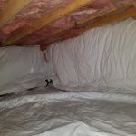 Mitigated crawlspace with encapsulated insulation agaisnt foundation wall