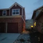 System to above roof, brick house.